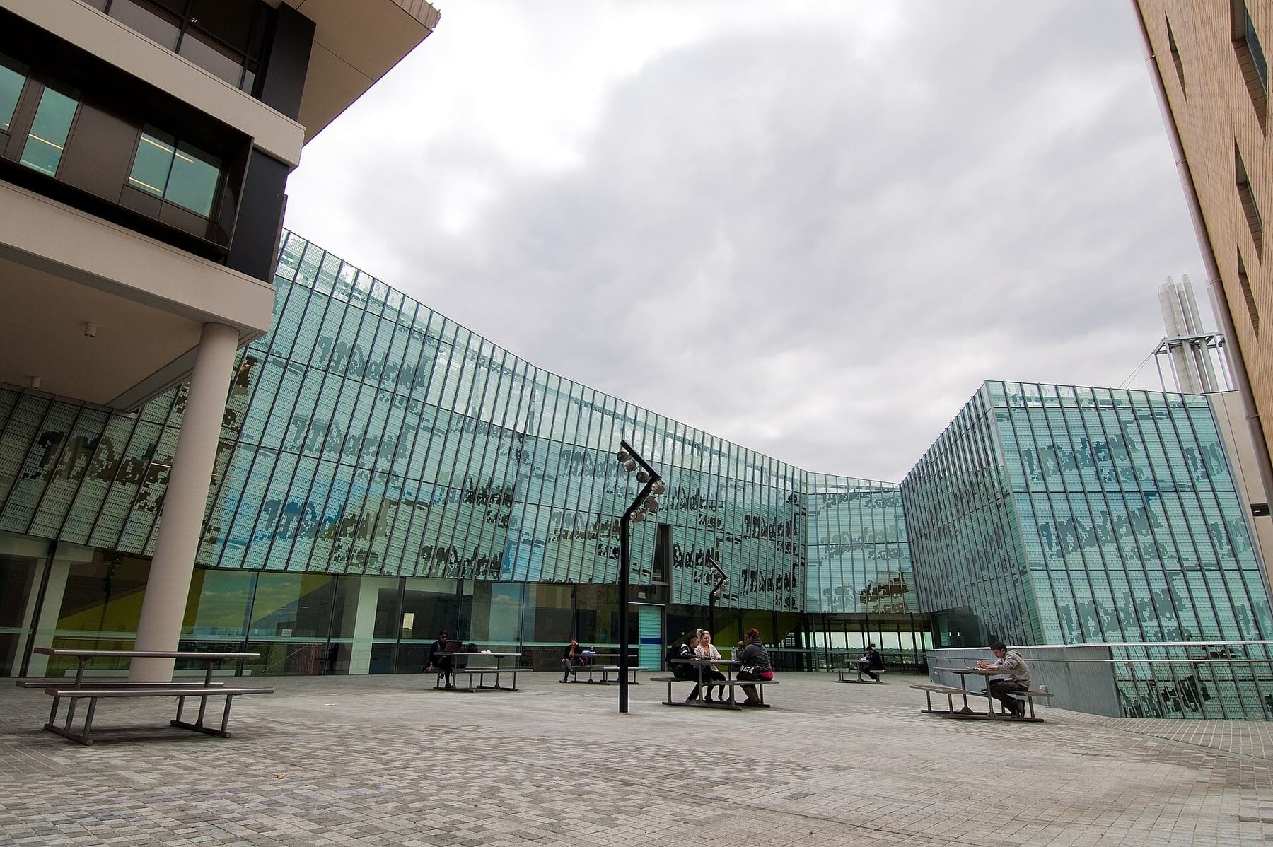 Glass-fronted Learning Commons building and courtyard at Footscray Park campus, Victoria University